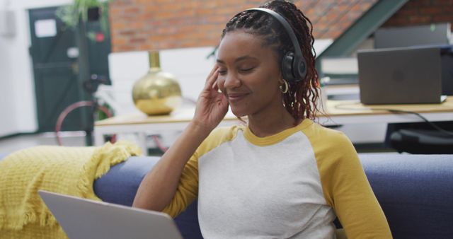 Woman Working Remotely on Laptop With Headphones - Download Free Stock Images Pikwizard.com