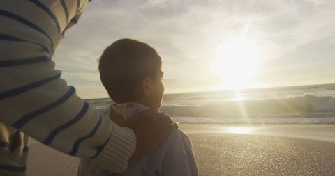 Father and Son Enjoying Peaceful Beach Sunset