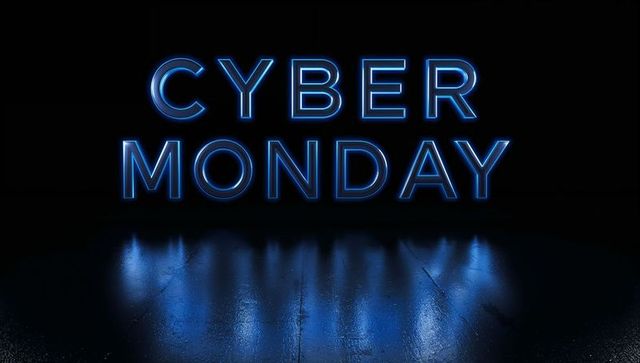 Glowing Blue Neon Cyber Monday Text with Wet Concrete Floor Reflection