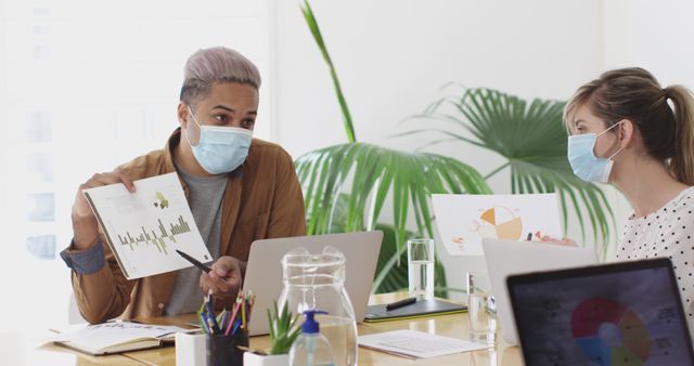 Business Meeting with Face Masks in Modern Office - Download Free Stock Images Pikwizard.com