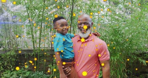 Grandparent Bonding in Garden with Enchanting Glowing Orbs