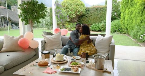 Romantic Celebration with Cake and Champagne on Outdoor Patio