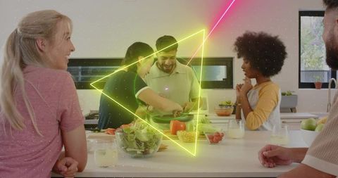 Friends gathering and cooking at modern kitchen island with neon triangle overlay