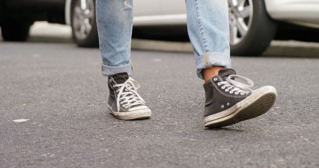 Casual Urban Stroll with Worn Sneakers and Rolled-Up Jeans - Download Free Stock Images Pikwizard.com