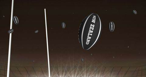 Floating Black Rugby Balls with New Zealand Text at Stadium
