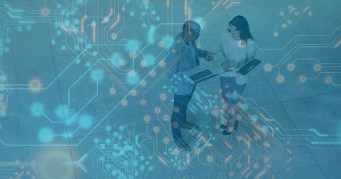 Business Colleagues Analyzing Digital Information with Circuit Overlay