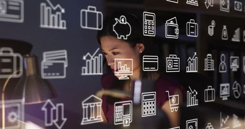 Businesswoman Analyzing Virtual Financial Data in Office