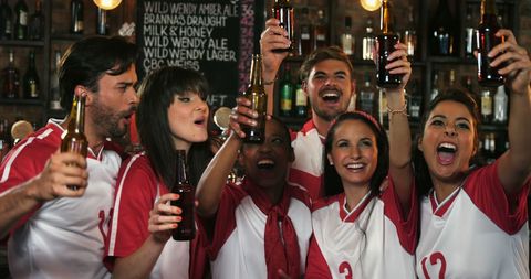 Diverse Young Adults Celebrating with Team Spirit - Download Free Stock Images Pikwizard.com