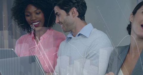 Office professionals collaborating with digital charts