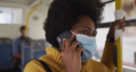 Young Woman with Face Mask Talking on Phone While Traveling in Bus - Download Free Stock Images Pikwizard.com