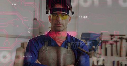 Welder standing in hacked industrial workshop with digital circuitry and cyber breach