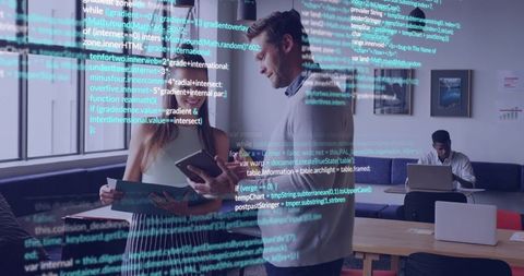 Professionals Collaborating Over Tablet and Prints with Code Overlay in Modern Office