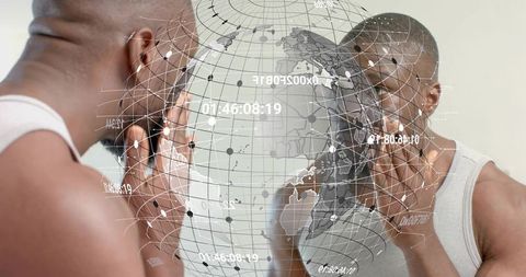 Black man inspecting skin in mirror with augmented reality globe overlay for grooming