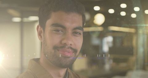 Smiling Biracial Businessman with Digital Light Effects