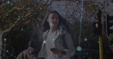 Digital Connection Network Overlay on Woman with Smartphone Outdoors