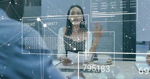 Businesswoman Presenting Data Analysis in Modern Office Environment