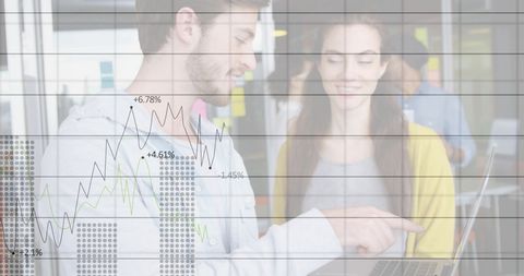 Business colleagues analyzing financial chart on laptop