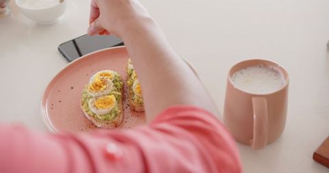 Healthy breakfast scene with avocado toast and latte