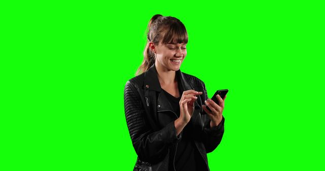 Happy Woman in Leather Jacket Using Smartphone with Green Screen Background - Download Free Stock Images Pikwizard.com