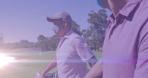 Male Golfers Enjoying a Game with Masks on Sunny Day