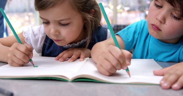 Children Drawing Together with Colored Pencils - Download Free Stock Images Pikwizard.com