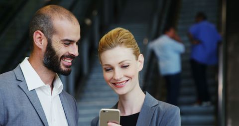 Business Professionals Checking Smartphone at Airport - Download Free Stock Images Pikwizard.com