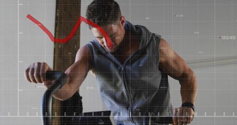 Pedaling intensity: man training on stationary bike with fitness analytics overlay