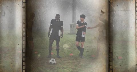Training on vintage field: soccer players practicing with ball, cones, film grain overlay
