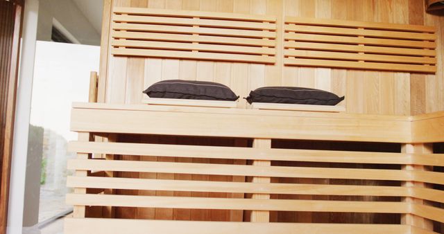 Image of empty wooden sauna room interior at holiday health spa resort. Relaxation, wellbeing and concept.