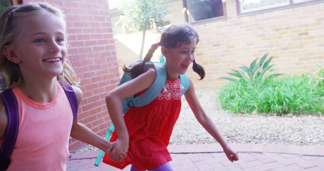 Joyful Children Running to School Hand in Hand - Download Free Stock Images Pikwizard.com