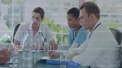 Medical Team Analyzing Patient Data with Overlaying Charts