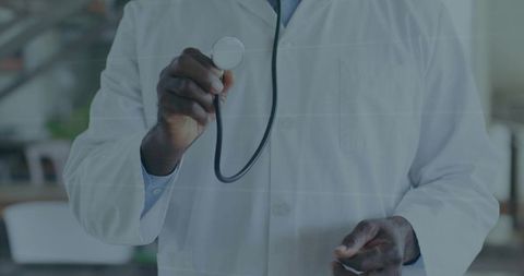 Senior Doctor Holding Stethoscope Over Chest Wearing White Lab Coat and Tie Medical Care