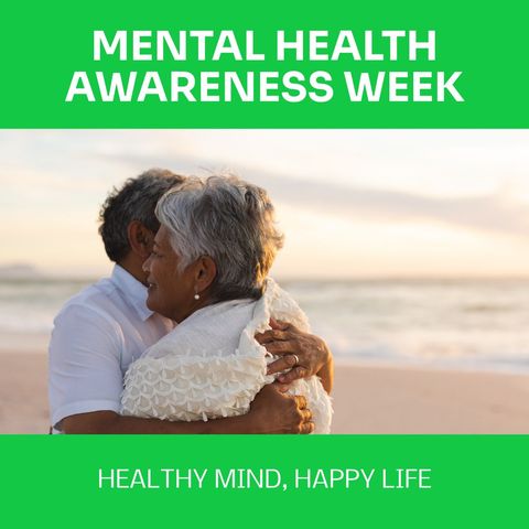 Senior couple embracing at beach for mental health awareness