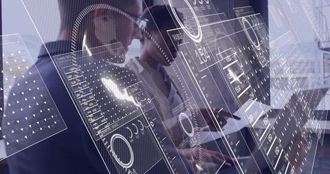 Team analyzing technology trends with digital interface in office