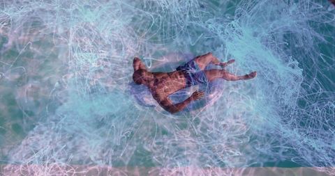Man Relaxing on Tube in Vibrant Aquatic Environment with Abstract Touch