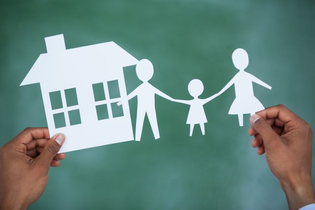 Man holding paper cut out family and house - Download Free Stock Photos Pikwizard.com