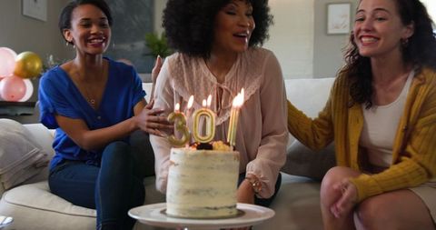 Diverse Group of Women Celebrating Birthday with Cake