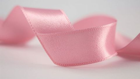 Pastel Pink Satin Ribbon on White Background