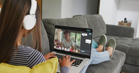 Teenage Student Using Laptop for Online Class at Home