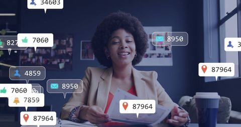 Businesswoman Managing Social Media Engagements in Office