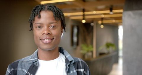 Smiling Young Man in Modern Office Setting