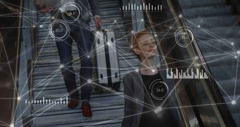 Businessman analyzing digital network connections on escalator