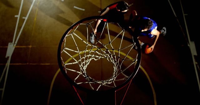 Top view of basketball players competing during night game - Download Free Stock Images Pikwizard.com