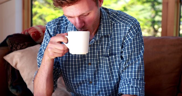 Man Enjoying Morning Coffee in Cozy Living Room - Download Free Stock Images Pikwizard.com