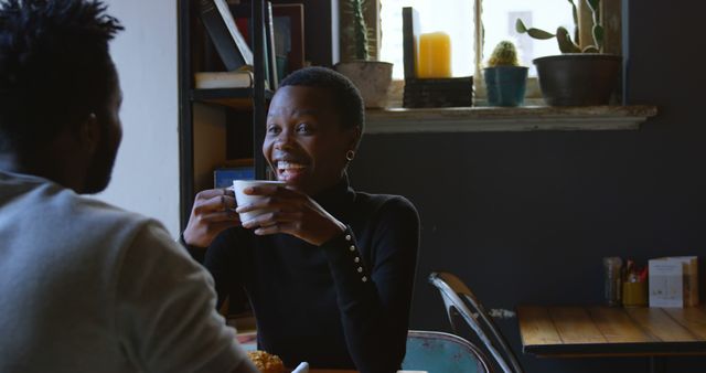 Happy Woman Enjoying Coffee at Cozy Cafe with Friend - Download Free Stock Images Pikwizard.com