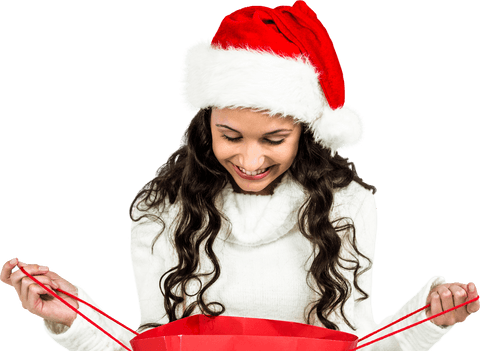 Happy woman in santa hat looking into red shopping bag on transparent background