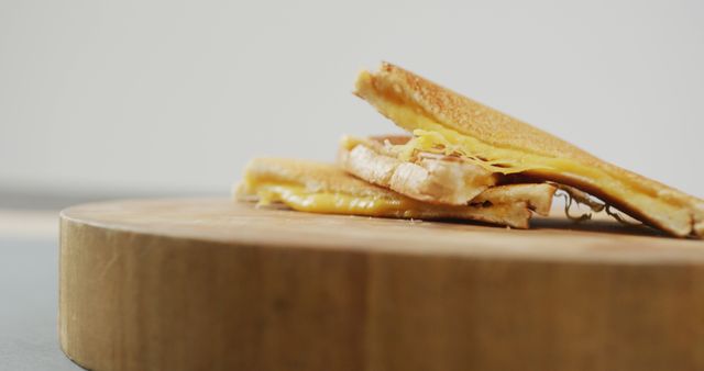 Image of close up of freshly prepared cheese white bread sandwich on wooden board. fusion food and home made snack concept.