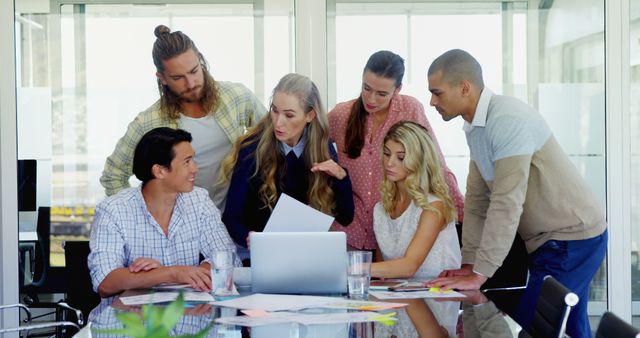 Diverse Team Brainstorming in Modern Office Around Laptop - Download Free Stock Images Pikwizard.com