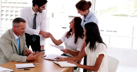 Professionals Shaking Hands in Office Meeting - Download Free Stock Images Pikwizard.com
