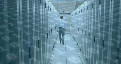 Man Walking in Modern Server Room with Data Overlay - Download Free Stock Images Pikwizard.com